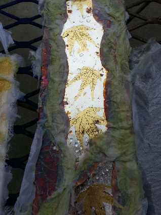 Student sample board with chemicals applied with tissue paper to create patina.