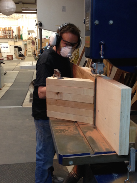 David is making the last cut for the evening. You can see the auxiliary fence that he made which is two sheets of 1" thick Baltic birch plywood glued together and cut to 11 1/2 inches tall (wide), sanded to 320 grit, waxed and screwed to his existing wooded fence.